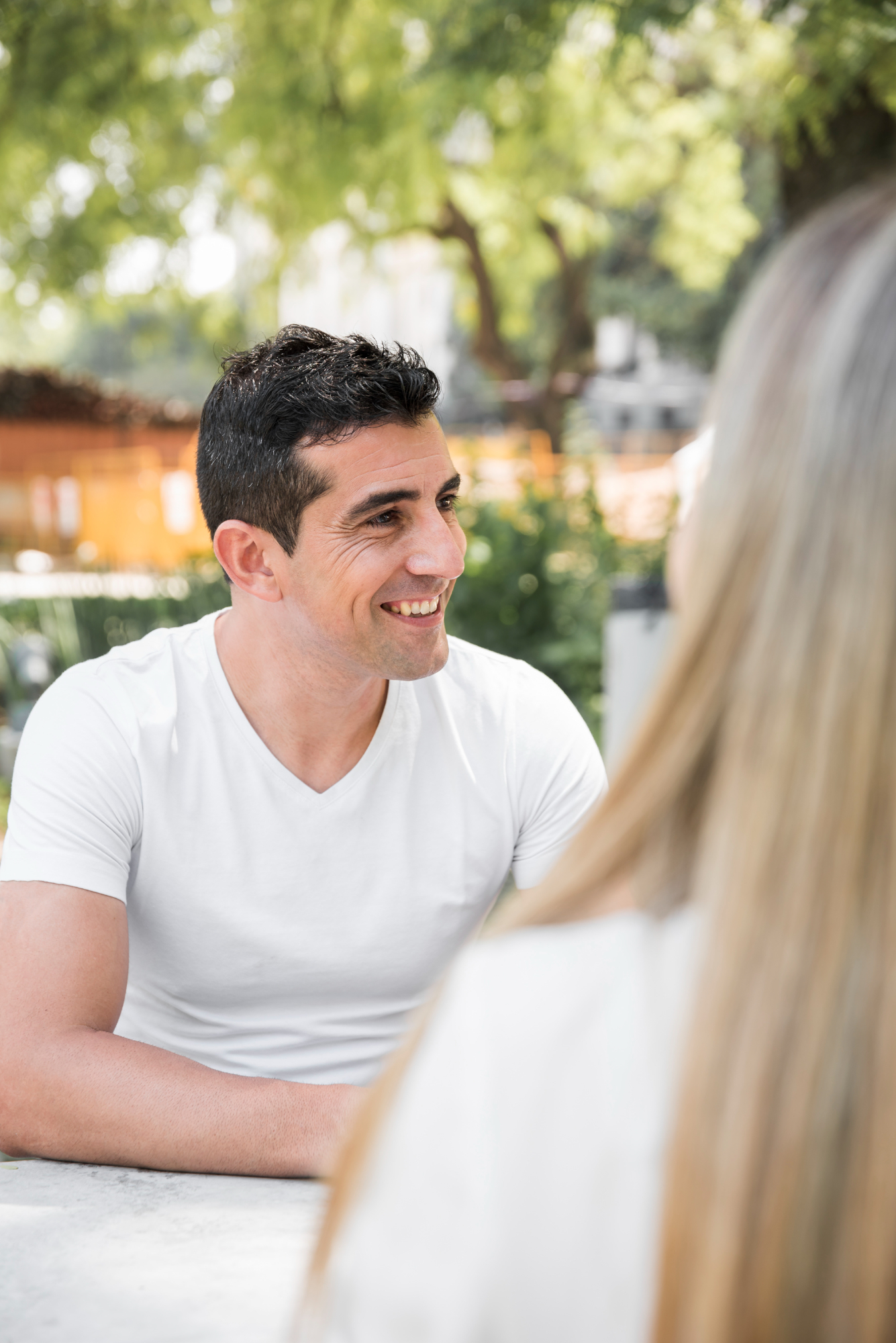 A happy couple talking to someone | Source: Freepik