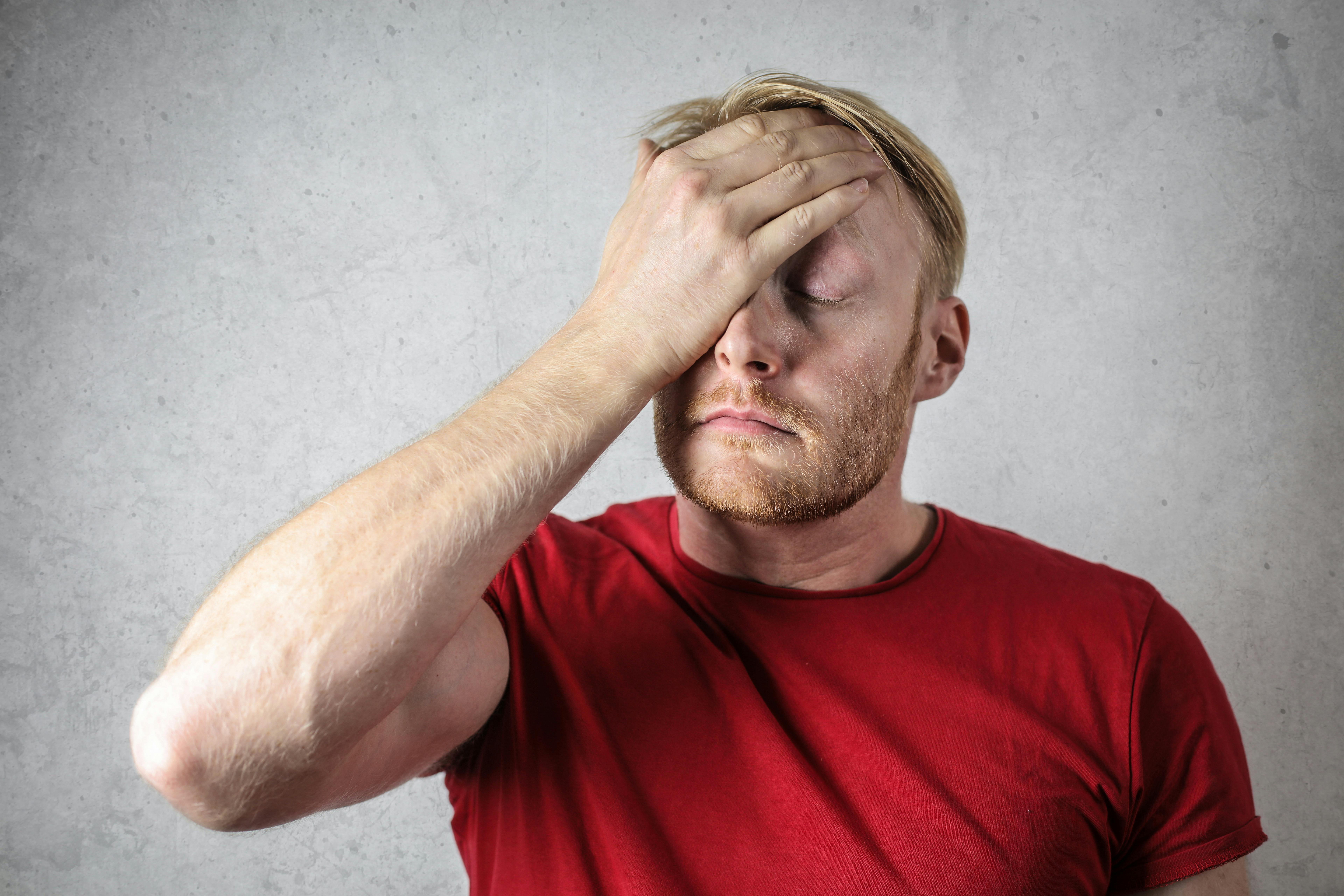 A man with his hand on his forehead in regret | Source: Pexels