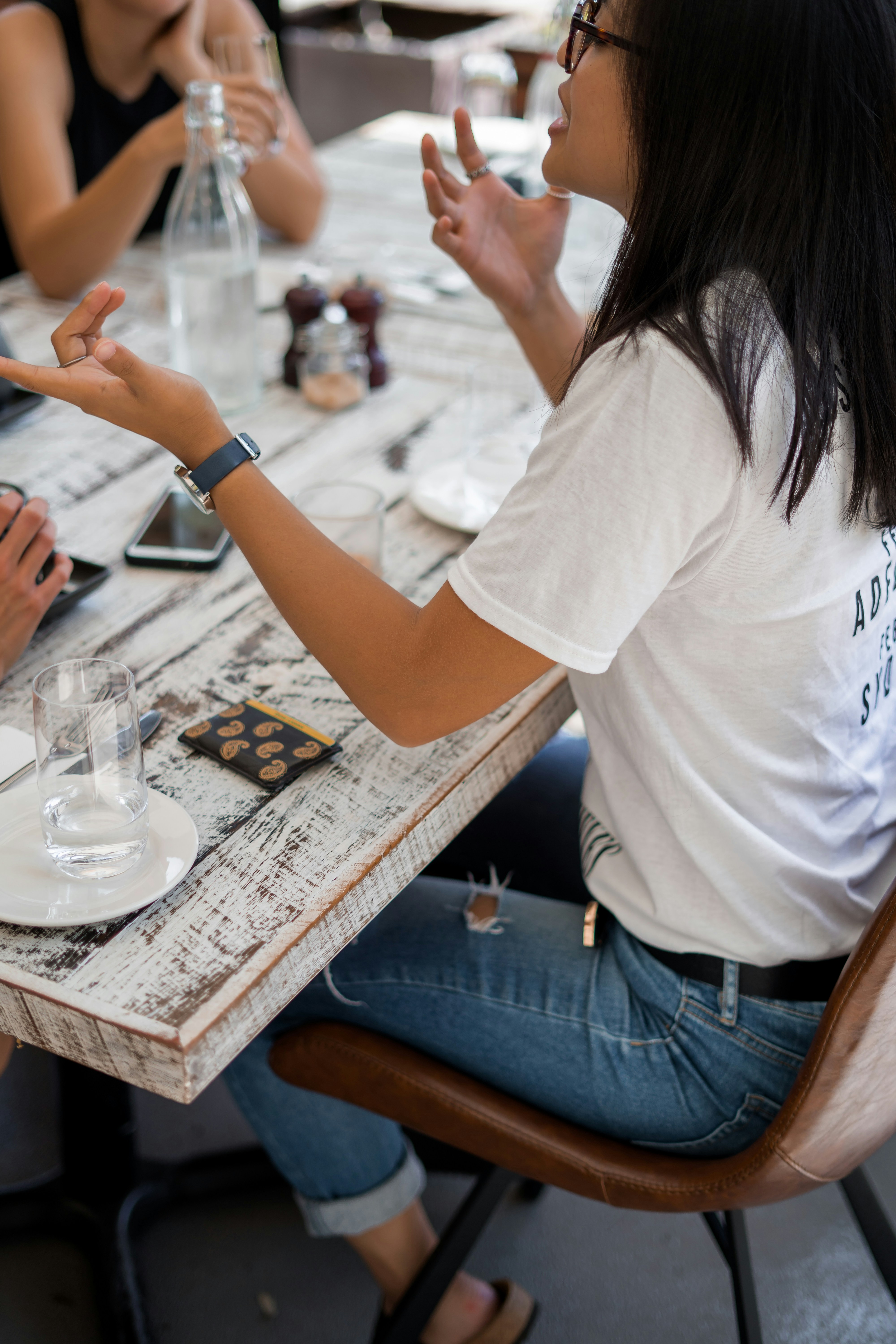 People talking over dinner | Source: Unsplash