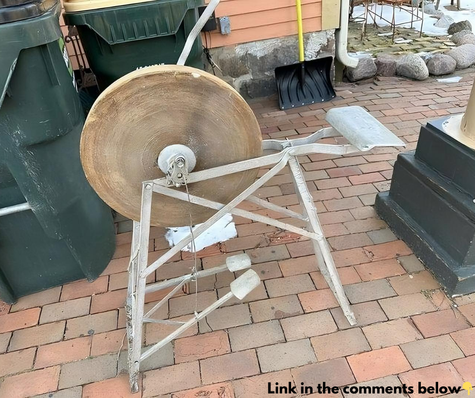 Can anyone identify this? I’m at a holiday cottage, and this is in the garden. It’s mostly metal, has a pedal attached to a large cog with a bolt above it, and looks very old Can anyone identify this? I’m at a holiday cottage, and this is in the garden. It’s mostly metal, has a pedal attached to a large cog with a bolt above it, and looks very old