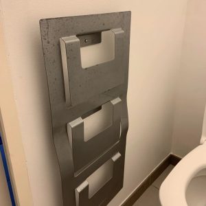 This metal piece is attached to the wall in a WC in my Airbnb in France. What is it ?