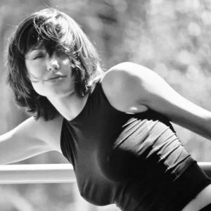 Black tank top, radiant smile, and a spirit that broke every rule. Actress, icon, and the woman who made Hollywood gasp. Curious who she is?